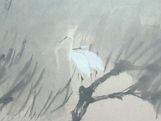 two herons in the trees