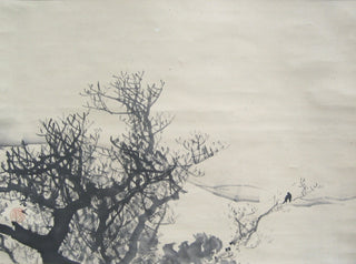 Crow in a bare tree in the snow
