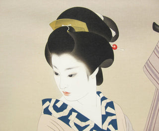 Woman In front of cloth rack
