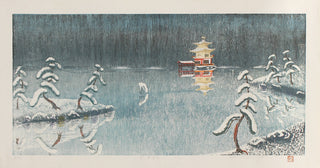 Temple au bord du lac sous la neige