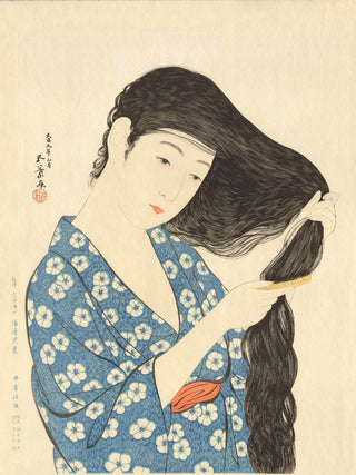 Woman combing hair